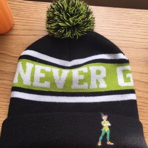 Peter Pan snow cap. Says “Never grow up”